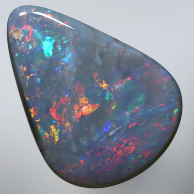 SOLID SEMI BLACK OPAL Sparkles of fire red and orange over blue green